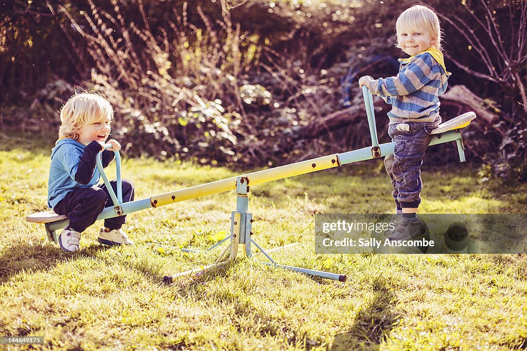 Children playing on seesaw