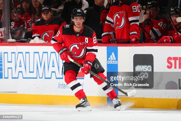 Jack Hughes of the New Jersey Devils skates against the Nashville Predators on December 1, 2022 at the Prudential Center in Newark, New Jersey.