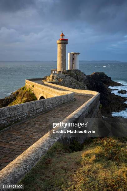 sunrise on the lighthouse "petit minou" in bretagne - brest brittany stockfoto's en -beelden