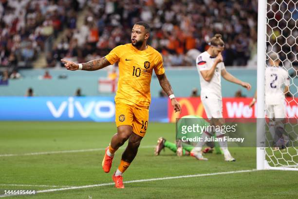 Memphis Depay of Netherlands celebrates after scoring the team's first goal during the FIFA World Cup Qatar 2022 Round of 16 match between...