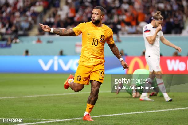 Memphis Depay of Netherlands celebrates after scoring the team's first goal during the FIFA World Cup Qatar 2022 Round of 16 match between...
