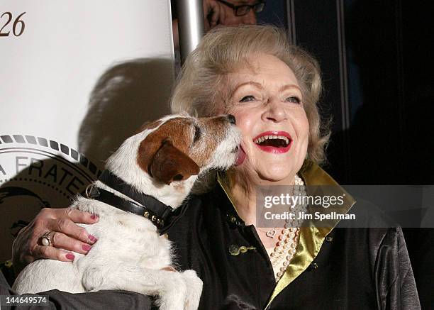 Actress Betty White and Uggie the dog attends The Friars Club Salute To Betty White at Sheraton New York Hotel & Towers on May 16, 2012 in New York...