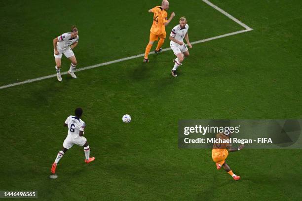 Memphis Depay of Netherlands scores the team's first goal during the FIFA World Cup Qatar 2022 Round of 16 match between Netherlands and USA at...