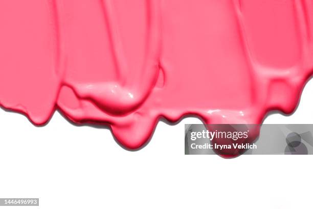 smears of thick face foundation in trendy color of the year 2023 viva magenta purple pink background. - dicht stock-fotos und bilder