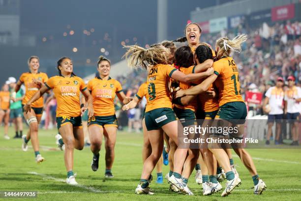 Players of Australia celebrate victory during the Women's Cup Final match between New Zealand and Australia on Day Two of the HSBC World Rugby...