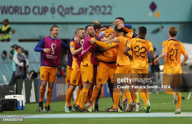 Daley Blind of Netherlands celebrates with teammates after scoring the team's second goal during the FIFA World Cup Qatar 2022 Round of 16 match...