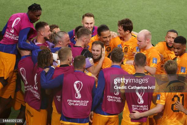 Daley Blind of Netherlands celebrates with teammates after scoring the team's second goal during the FIFA World Cup Qatar 2022 Round of 16 match...