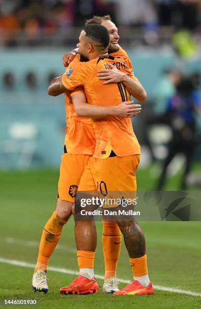 Daley Blind of Netherlands celebrates with Memphis Depay after scoring the team's second goal during the FIFA World Cup Qatar 2022 Round of 16 match...