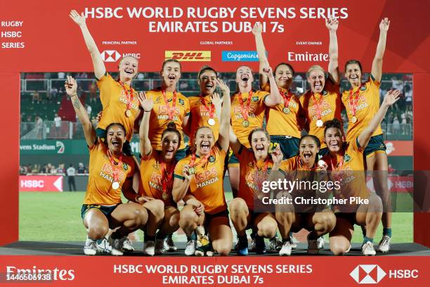 Players of Australia celebrate victory during the Women's Cup Final match between New Zealand and Australia on Day Two of the HSBC World Rugby...