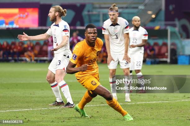 Denzel Dumfries of Netherlands celebrates after scoring the team's third goal during the FIFA World Cup Qatar 2022 Round of 16 match between...