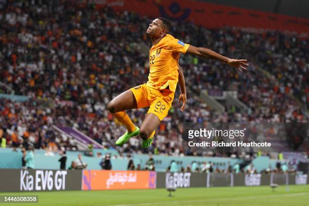Denzel Dumfries of Netherlands celebrates after scoring the team's third goal during the FIFA World Cup Qatar 2022 Round of 16 match between...