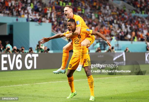 Denzel Dumfries of Netherlands celebrates after scoring the team's third goal during the FIFA World Cup Qatar 2022 Round of 16 match between...