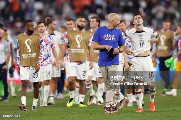 Head coach Gregg Berhalter and Christian Pulisic of United States react after their sides' elimination from the tournament during the FIFA World Cup...