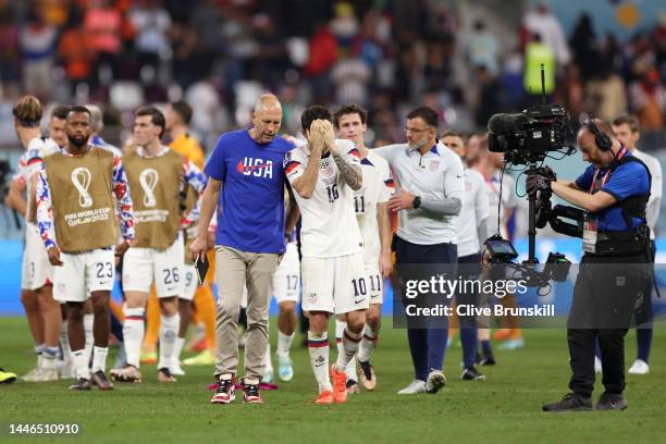 Head coach Gregg Berhalter and Christian Pulisic of United States react after their sides' elimination from the tournament during the FIFA World Cup...