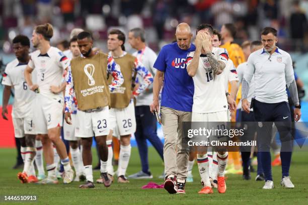 Head coach Gregg Berhalter and Christian Pulisic of United States react after their sides' elimination from the tournament during the FIFA World Cup...