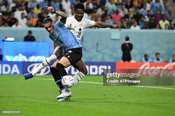 Edinson Cavani of Uruguay and Daniel Amartey of Ghana in action during the FIFA World Cup Qatar 2022 Group H match between Ghana and Uruguay at Al...