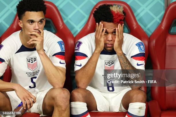 Antonee Robinson and Weston McKennie of United States look dejected after their sides' elimination from the tournament during the FIFA World Cup...