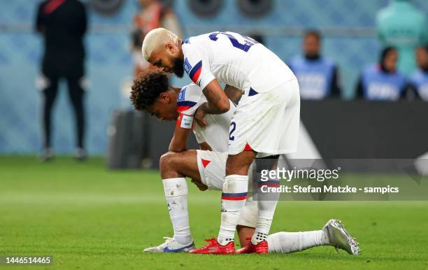 Tyler Adams of USA and DeAndre Yedlin of USA look dejected after their team's elimination from the tournament during the FIFA World Cup Qatar 2022...
