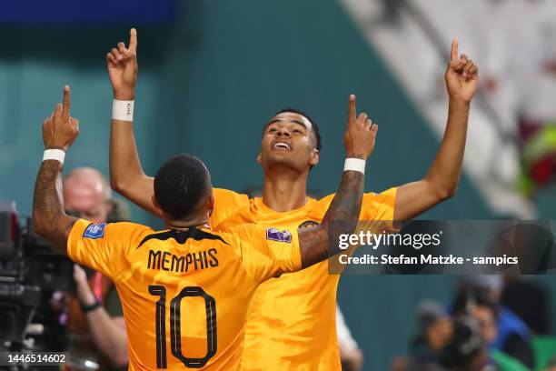 Memphis Depay of Netherlands celebrates with Cody Gakpo of Netherlands after he scored a goal during the FIFA World Cup Qatar 2022 Round of 16 match...