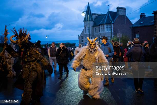 Participants parade through the streets during the annual Whitby Krampus run on December 03, 2022 in Whitby, England. The Krampus is a horned,...