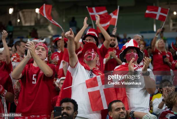 Denmark fans wave flags during the FIFA World Cup Qatar 2022 Group D match between Australia and Denmark at Al Janoub Stadium on November 30, 2022 in...