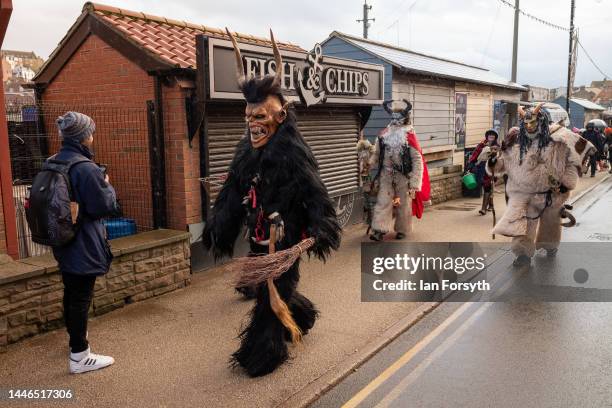 Participants prepare to parade through the streets during the annual Whitby Krampus run on December 03, 2022 in Whitby, England. The Krampus is a...