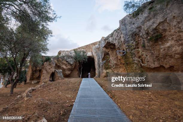 Visitor walks into the Fabrica Hill Catacombs on November 24, 2022 in Paphos, Cyprus.
