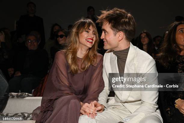 Suki Waterhouse and Robert Pattinson attend the Dior Fall 2023 Menswear Show on December 03, 2022 in Giza, Egypt.