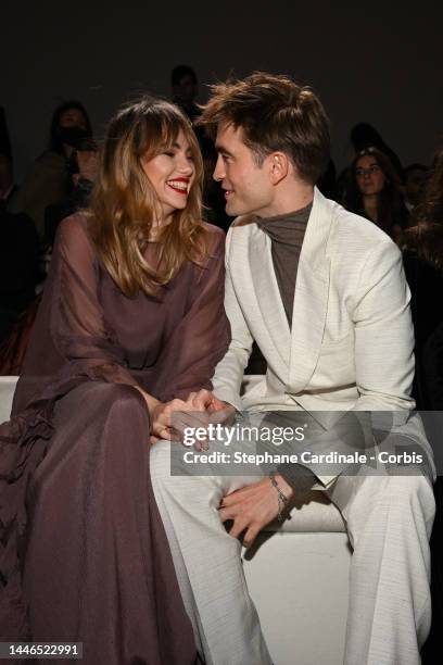 Suki Waterhouse and Robert Pattinson attend the Dior Fall 2023 Menswear Show on December 03, 2022 in Giza, Egypt.