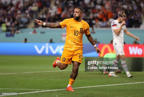 Memphis Depay of Netherlands celebrates scoring the team's first goal during the FIFA World Cup Qatar 2022 Round of 16 match between Netherlands and...