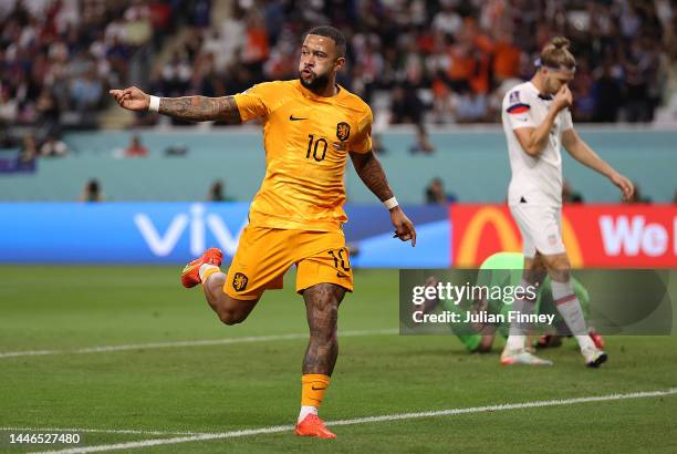 Memphis Depay of Netherlands celebrates scoring the team's first goal during the FIFA World Cup Qatar 2022 Round of 16 match between Netherlands and...