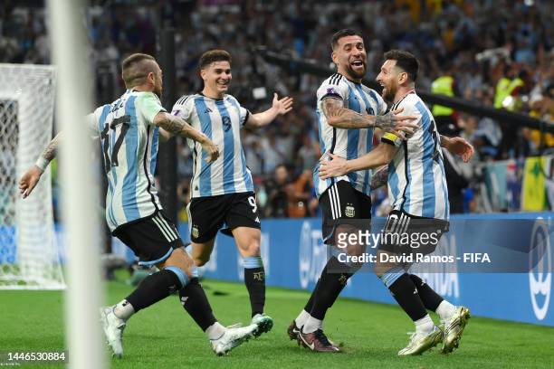 Lionel Messi of Argentina celebrates after scoring the team's first goal during the FIFA World Cup Qatar 2022 Round of 16 match between Argentina and...