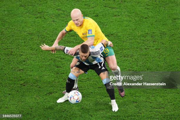 Alejandro Gomez of Argentina is challenged by Aaron Mooy of Australia during the FIFA World Cup Qatar 2022 Round of 16 match between Argentina and...