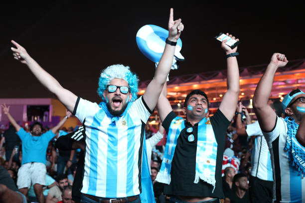 Fans of Argentina celebrate during the FIFA World Cup 2022 Qatar Fan Festival at Al Bidda Park on December 03, 2022 in Doha, Qatar.