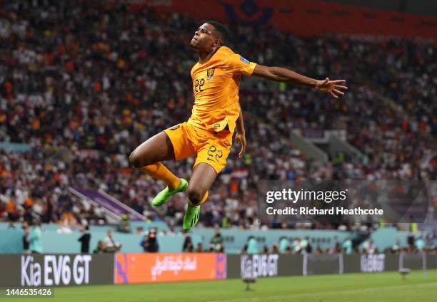 Denzel Dumfries of Netherlands celebrates after scoring the team's third goal during the FIFA World Cup Qatar 2022 Round of 16 match between...