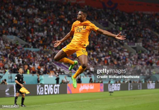 Denzel Dumfries of Netherlands celebrates after scoring the team's third goal during the FIFA World Cup Qatar 2022 Round of 16 match between...