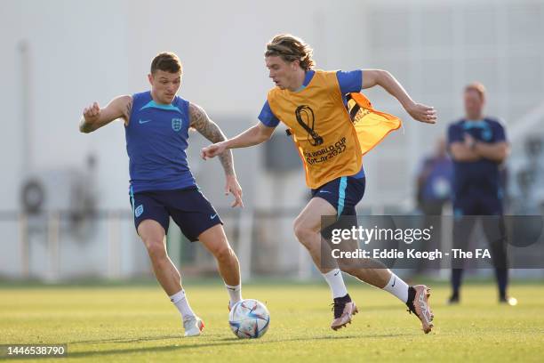 Conor Gallagher and Kieran Trippier of England battle for possession during an England training session at Al Wakrah Stadium on December 03, 2022 in...