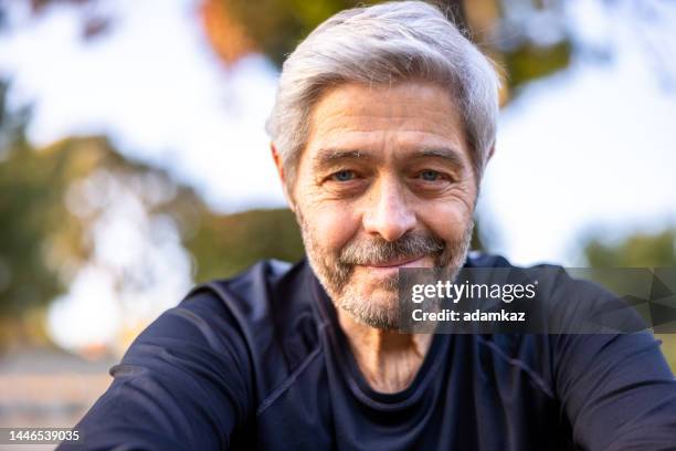 portrait of a senior man at a workout - smirk stock pictures, royalty-free photos & images