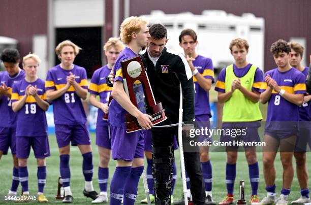 Williams College Ephs players accept their runner-up trophy after a loss to the University of Chicago Maroons in the Division III Men’s Soccer...