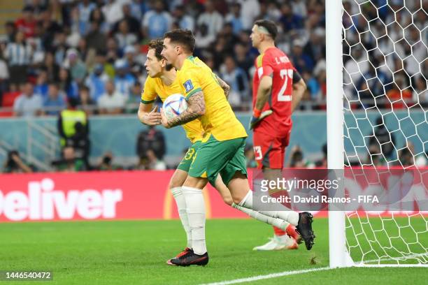 Craig Goodwin of Australia celebrates after an own goal by Enzo Fernandez of Argentina during the FIFA World Cup Qatar 2022 Round of 16 match between...