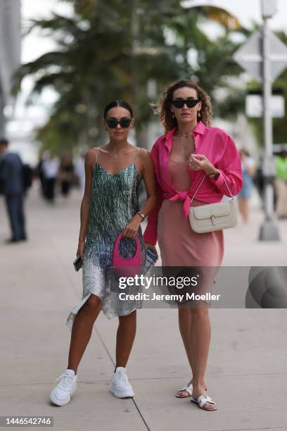 Marina Kuz seen wearing a pink Coperni bag, a dress by Off-White and Prada sneaker and Merz Marina seen wearing Hermès oran sandals and a beige dress...