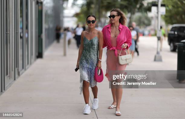 Marina Kuz seen wearing a pink Coperni bag, a dress by Off-White and Prada sneaker and Merz Marina seen wearing Hermès oran sandals and a beige dress...