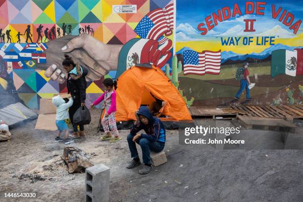 Immigrants wait for entrance to a migrant shelter on December 3, 2022 in Reynosa, Mexico. Thousands of immigrants have been waiting on the Mexican...