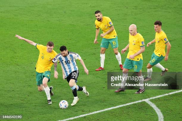 Lionel Messi of Argentina controls the ball against Australia defense during the FIFA World Cup Qatar 2022 Round of 16 match between Argentina and...