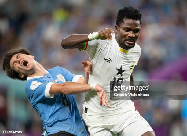 Facundo Pellistri of Uruguay reacts to a tackle by Daniel Amartey of Ghana during the FIFA World Cup Qatar 2022 Group H match between Ghana and...