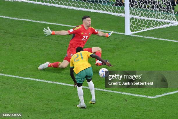 Emiliano Martinez of Argentina makes a save from Garang Kuol of Australia during the FIFA World Cup Qatar 2022 Round of 16 match between Argentina...