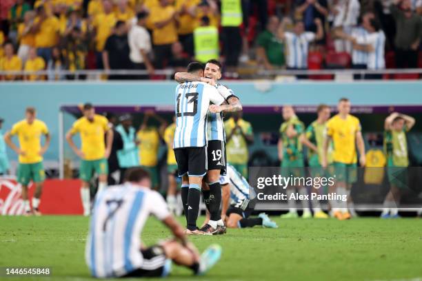 Cristian Romero and Nicolas Otamendi of Argentina celebrate their 2-1 victory in the FIFA World Cup Qatar 2022 Round of 16 match between Argentina...