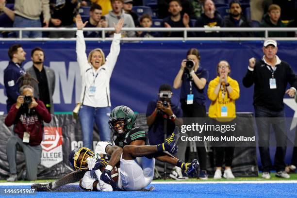 Demeer Blankemsee of the Toledo Rockets catches a touchdown pass against Tariq Drake of the Ohio Bobcats in the fourth quarter of the MAC...