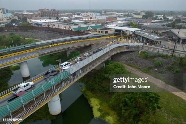 As seen from an aerial view, traffic waits to enter the U.S. From Mexican side of the Rio Grande on December 01, 2022 near Hidalgo, Texas. Thousands...