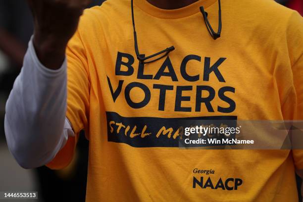 Member of the audience wearing a 'Black Voters Still Matter' t-shirt from Georgia NAACP as Georgia Democratic Senate candidate U.S. Sen. Raphael...